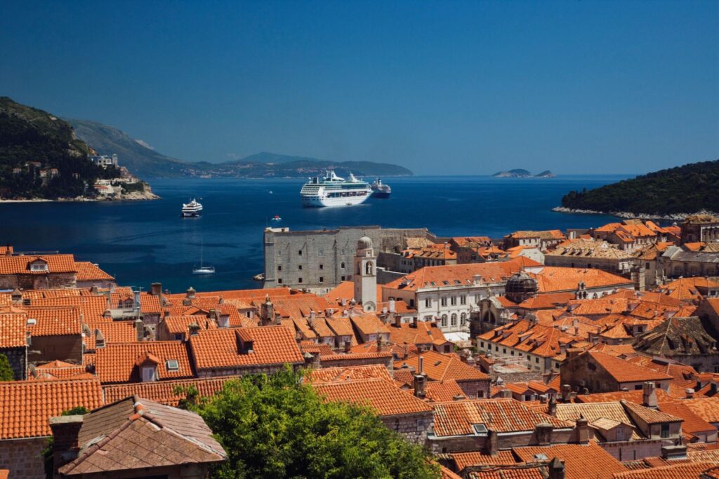 Dubrovnik Old Town rooftops with cruise ship in Adriatic Sea