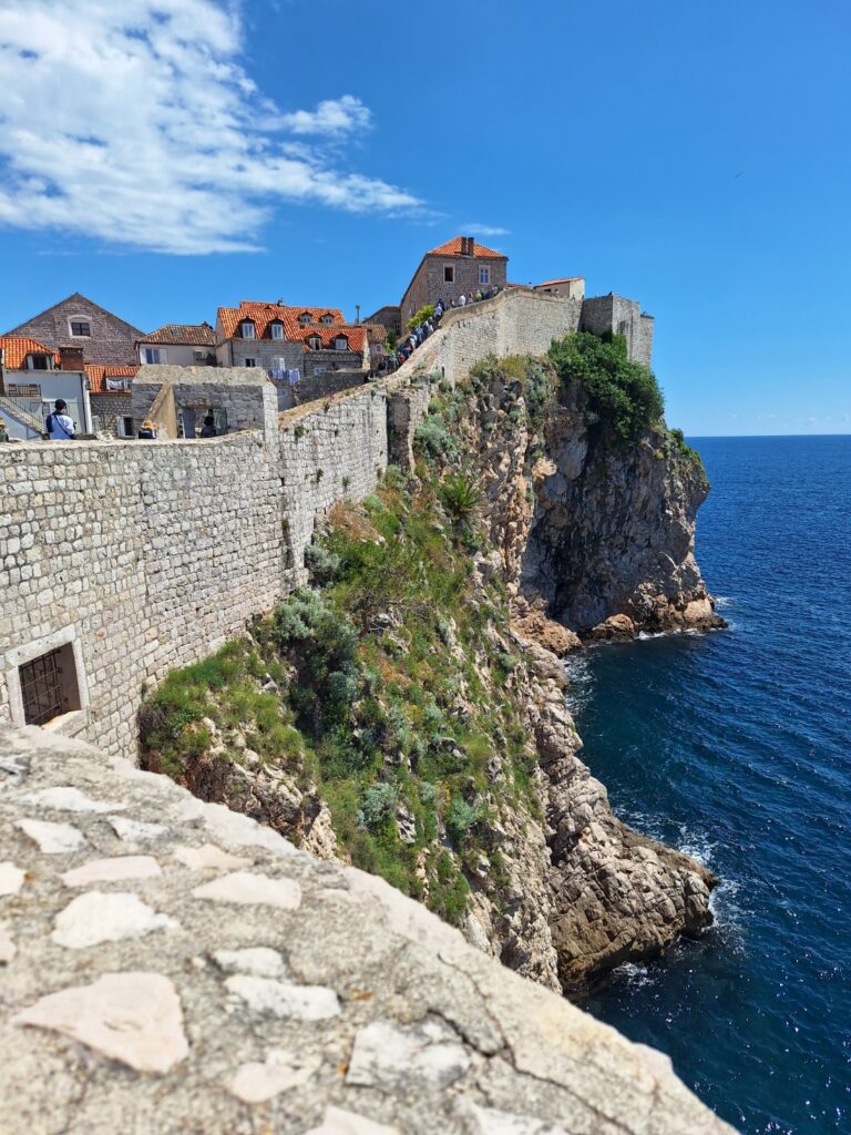 View from Dubrovnik City Walls overlooking the Adriatic Sea and Old Town cliffs