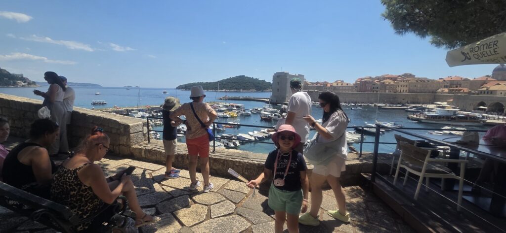 Family overlooking boats in Dubrovnik Old Port