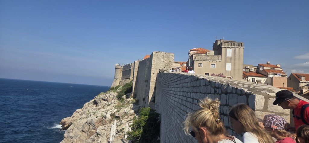 Family walking along the seaward section of Dubrovnik City Walls