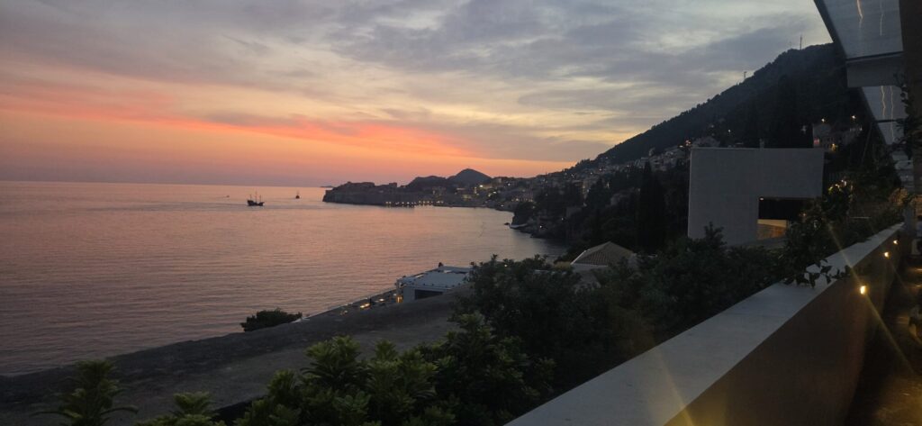 Romantic sunset over the Adriatic Sea and Dubrovnik coastline