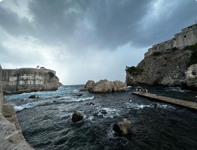 Dubrovnik Old Town coastline in November with cloudy sky and rough Adriatic Sea