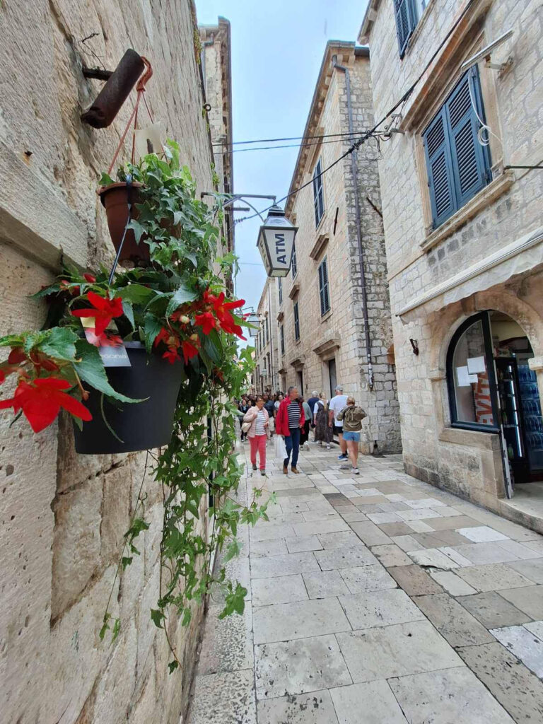 Dubrovnik Old Town street in March with light crowds and local atmosphere during early spring