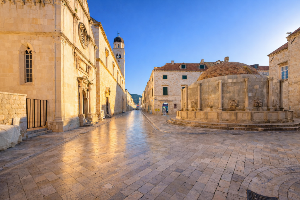 Sunny morning view of Dubrovnik Old Town near the Onofrio Fountain and Stradun without crowds