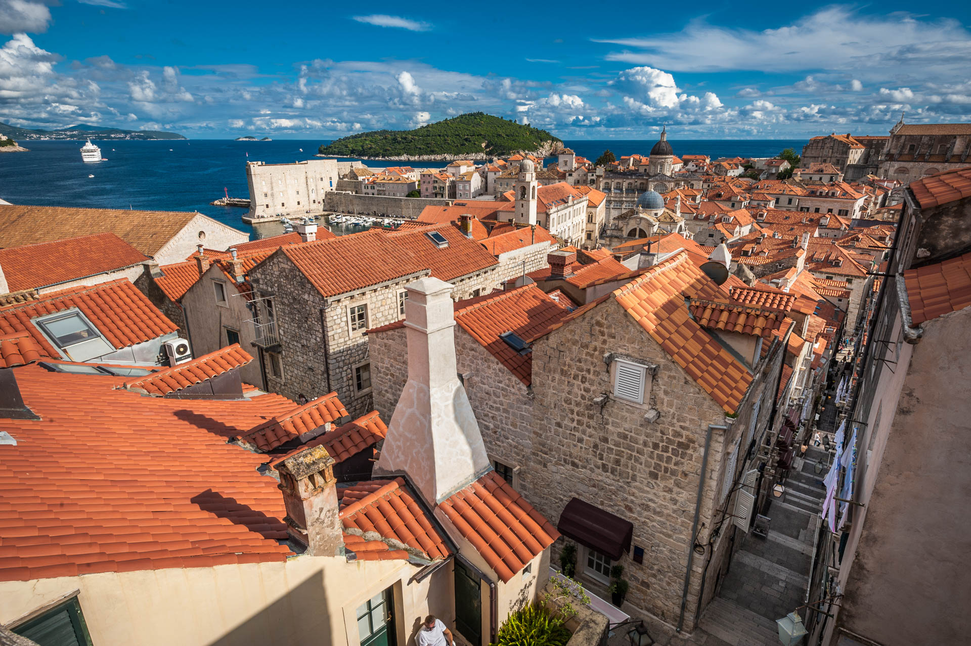 Panoramic view of Dubrovnik Old Town rooftops, harbor and Lokrum island