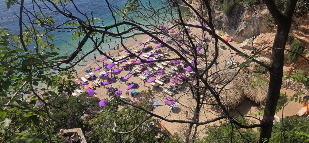 Sveti Jakov Beach in Dubrovnik with clear Adriatic water and pebble shoreline