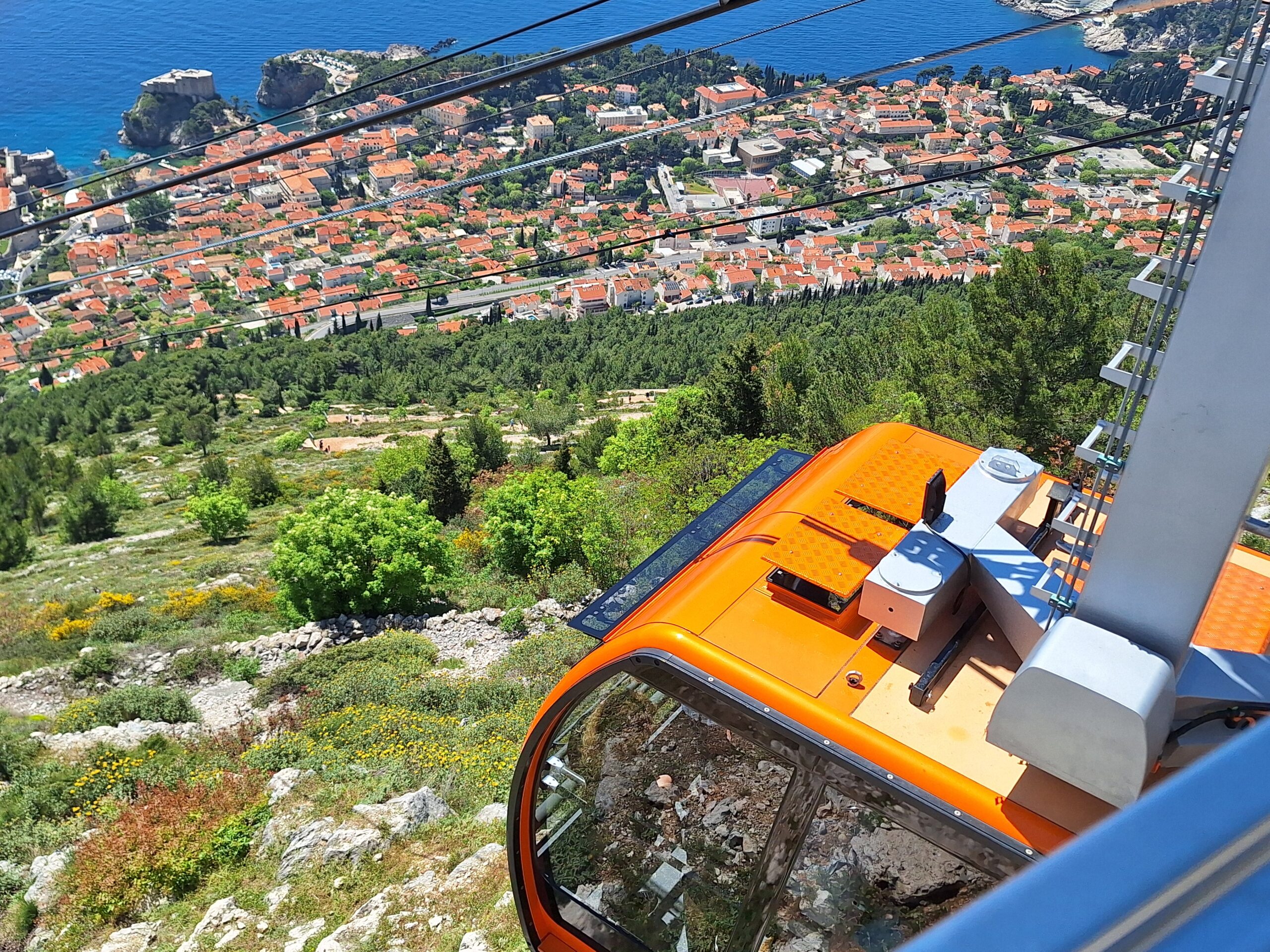 Dubrovnik cable car cabin view from Mount Srđ overlooking Old Town, Lokrum Island and Adriatic Sea