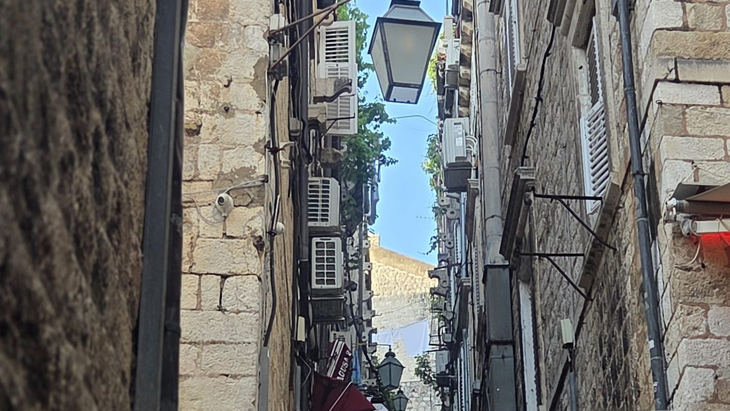 Narrow stone staircase in Dubrovnik's Old Town revealing one of the city's hidden streets away from the main tourist routes.
