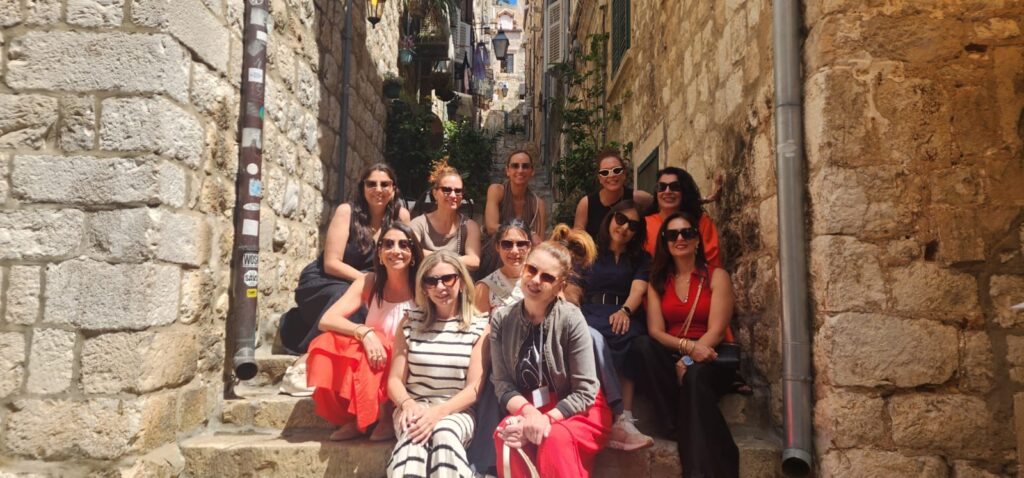 group enjoying a private walking tour in a quiet Dubrovnik old town street