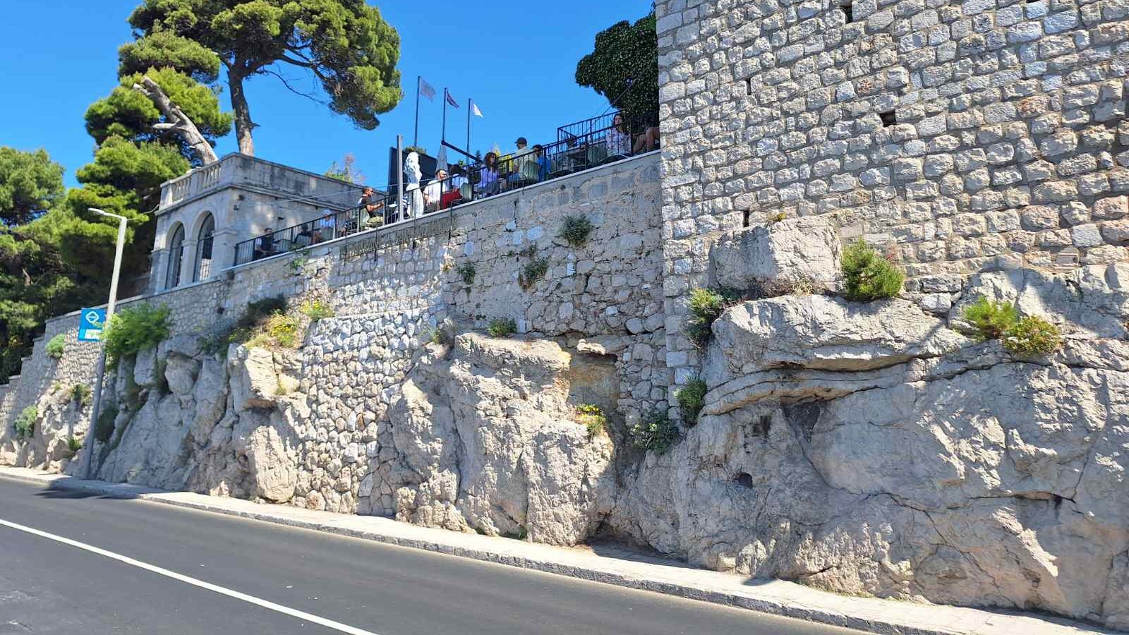 Well-maintained public spaces in Dubrovnik, Croatia, showing clean streets, historic stone walls, and Mediterranean landscaping.