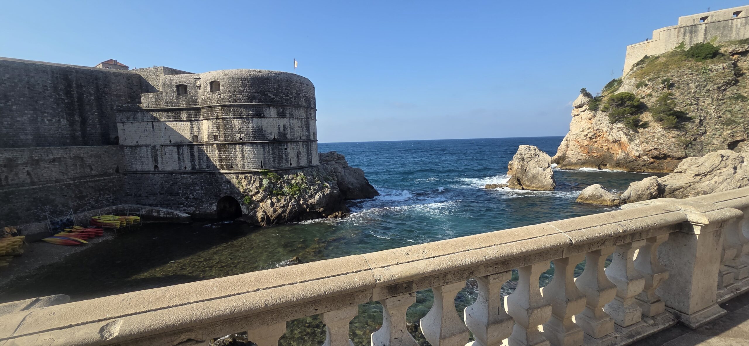 Fort Lovrijenac and Dubrovnik coastline with stone terrace, cliffs, and Adriatic Sea