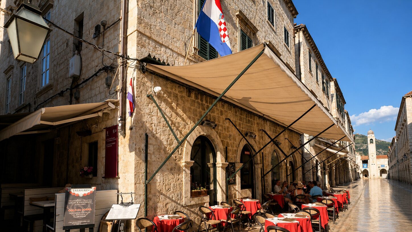 Morning café scene in Dubrovnik Old Town near Stradun, showing quiet streets and outdoor tables before the busiest part of the day
