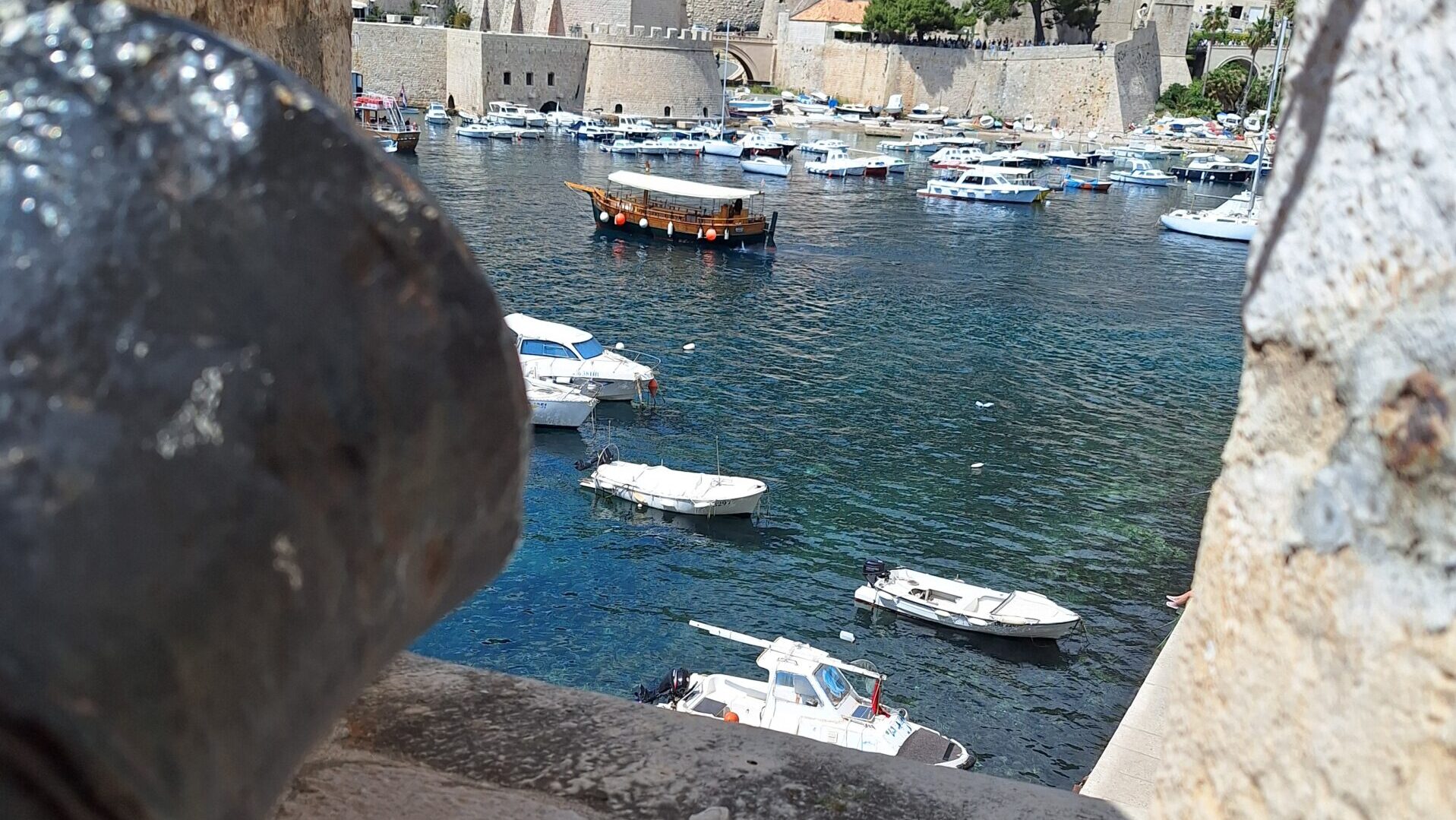 View of Dubrovnik's harbor through the city walls, symbolizing strategic thinking, leadership, and long-term planning