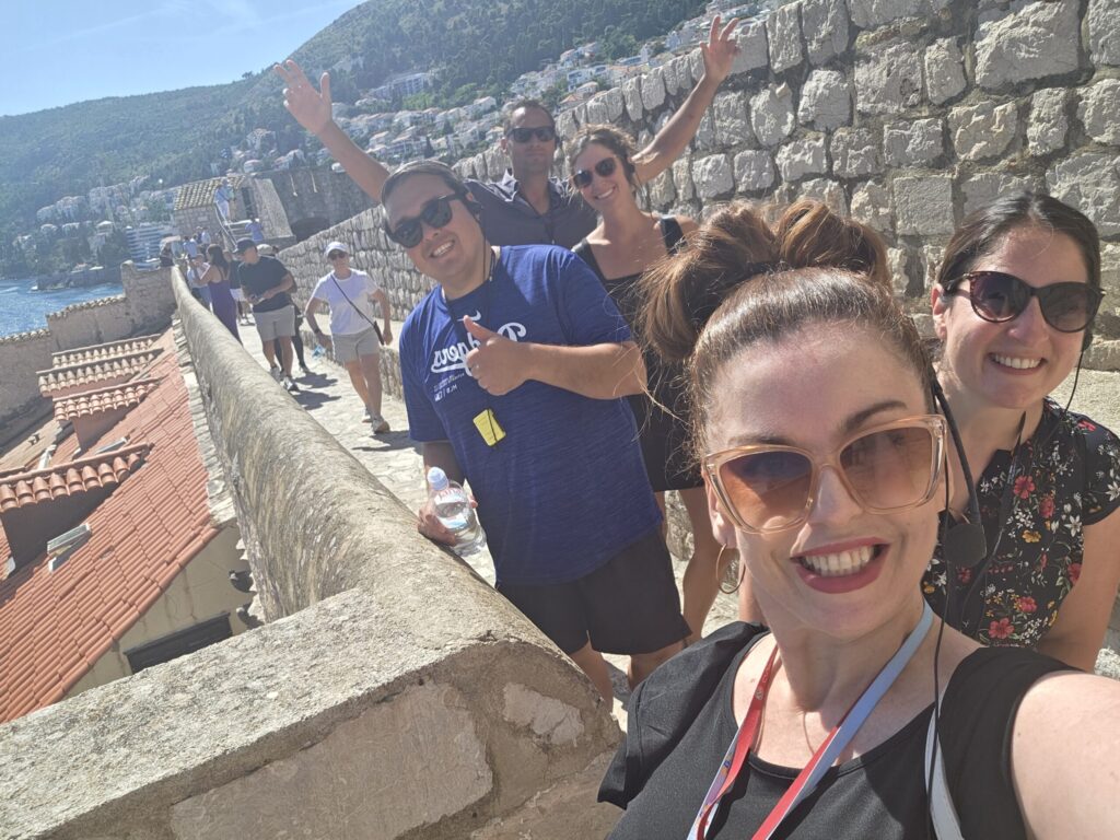 Private Dubrovnik guide with smiling guests enjoying a fun and relaxed City Walls tour.