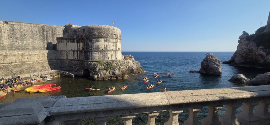 Dubrovnik fortress with sea view, kayaks and cliffs on the Adriatic coast