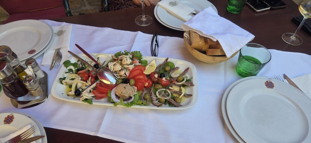 Mediterranean plate with seafood, tomatoes, olives and local flavors on a Ston tour