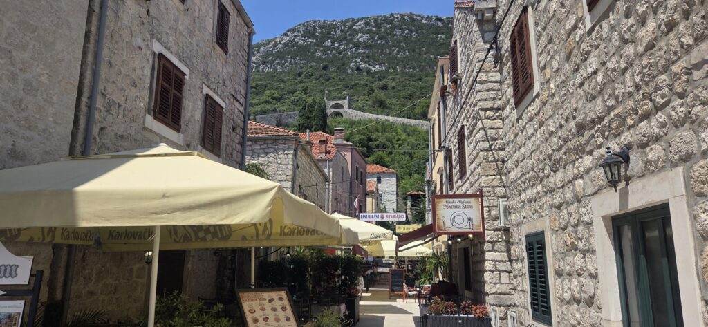 Stone streets of Ston Old Town with a view of the Ston walls