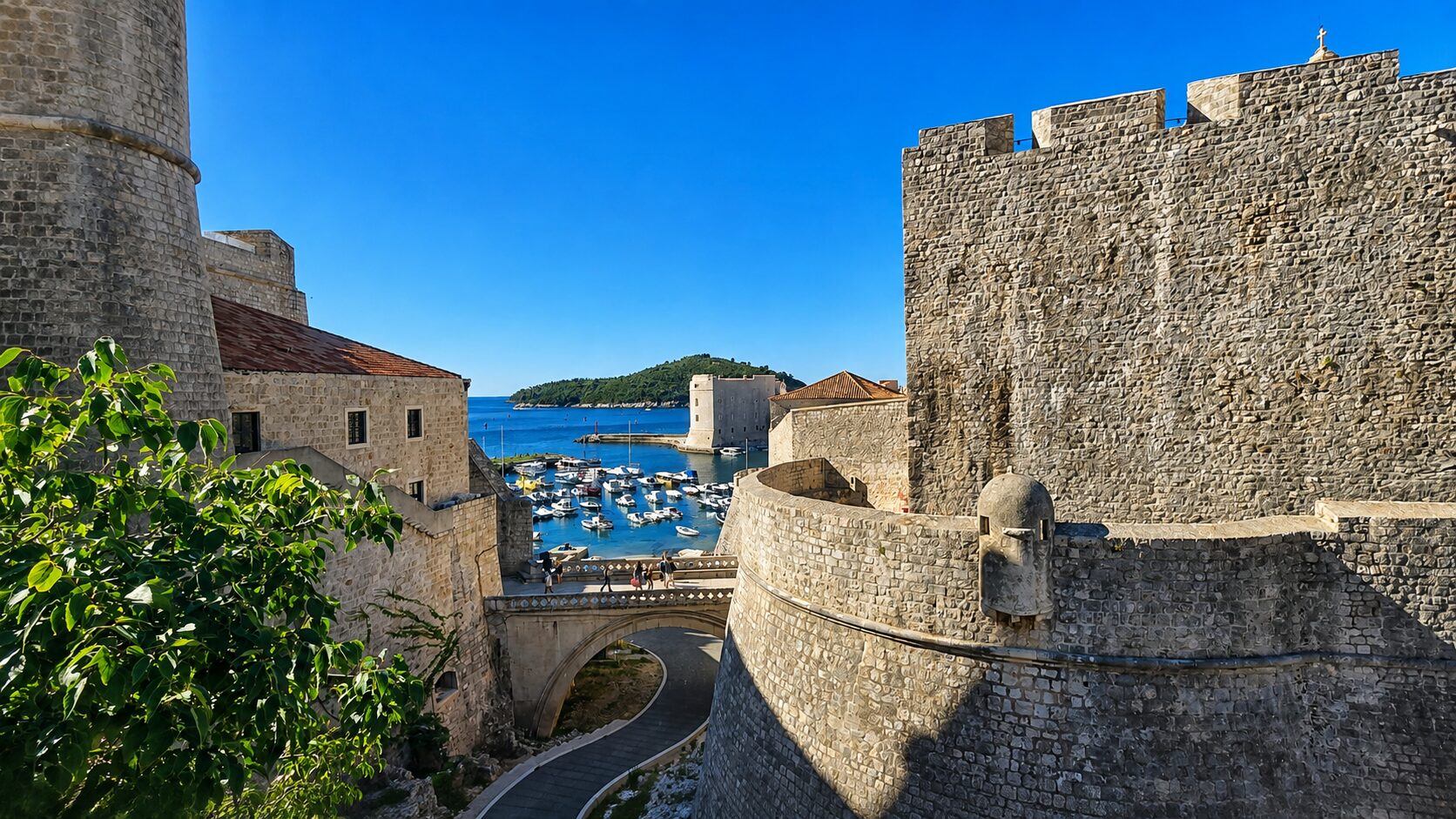 View of Dubrovnik’s City Walls, Old Port and Lokrum Island from the historic centre