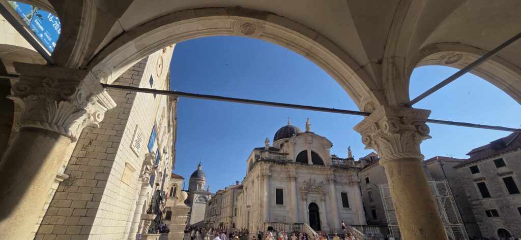 Church of St Blaise and Sponza Palace viewed through the arches of the Rector’s Palace in Dubrovnik Old Town