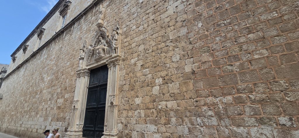 Pieta on the Gothic portal of the Franciscan Monastery Dubrovnik