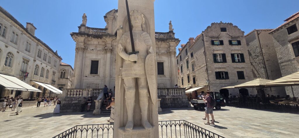 Orlando’s Column in Luža Square, with the Church of St Blaise behind it in Dubrovnik Old Town.